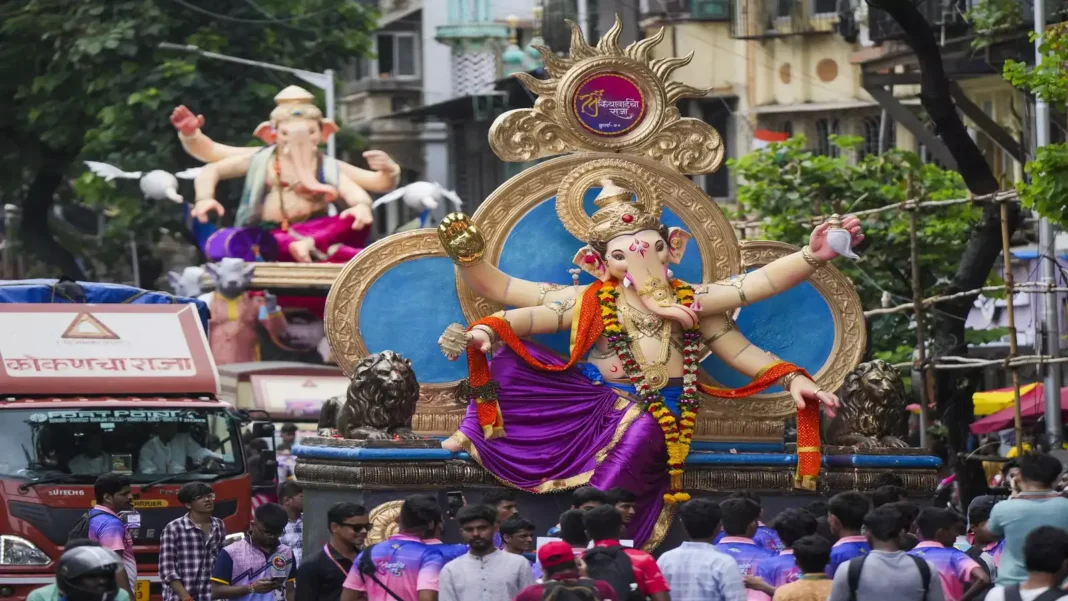Ganesh Visarjan celebration with devotees immersing Lord Ganesha idol